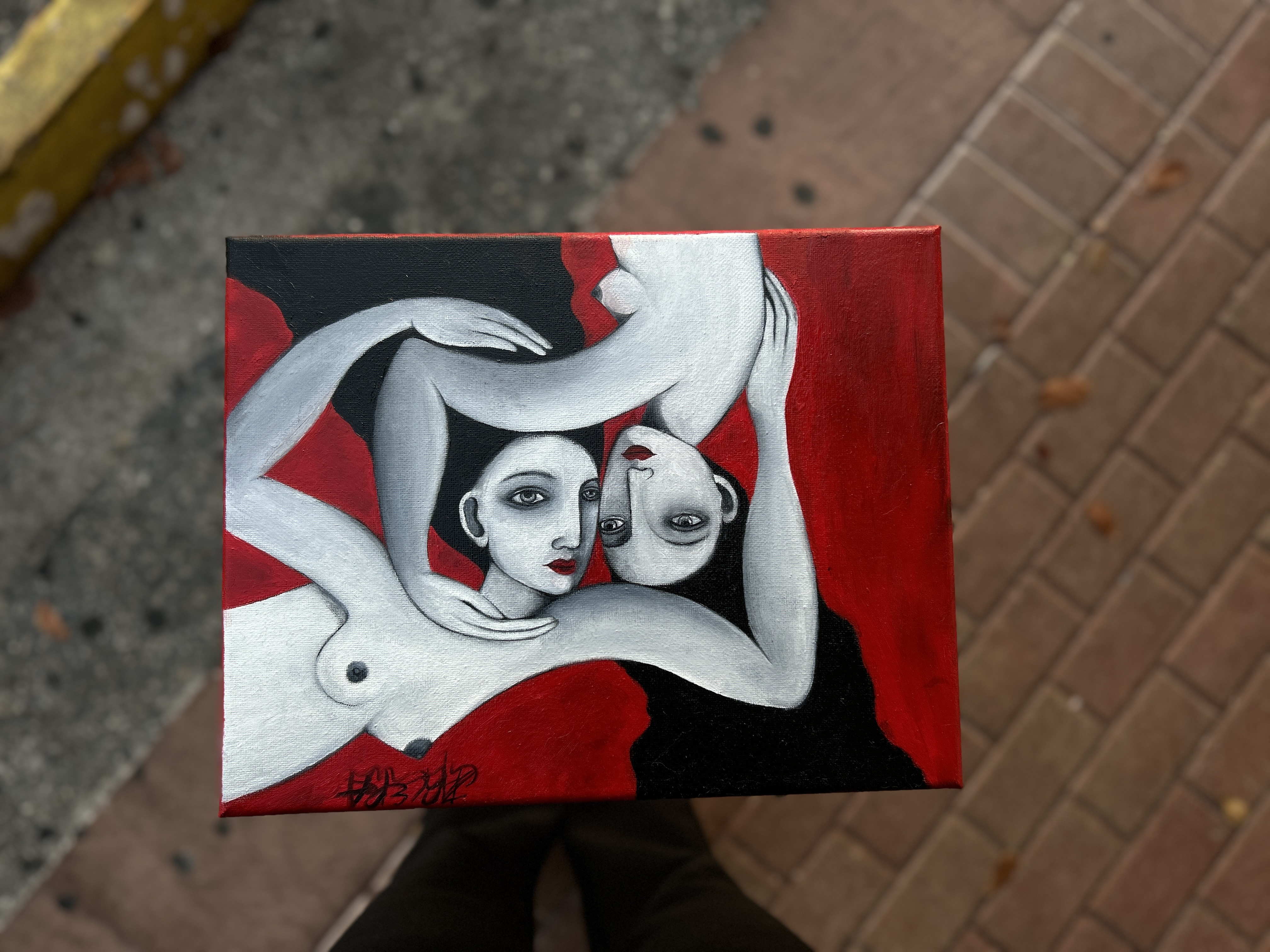 Intertwined figures, red and black